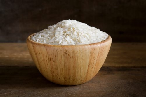 Jasmine,Rice,In,Wooden,Bowl,On,Rustic,Wood,Background.,Jasmine